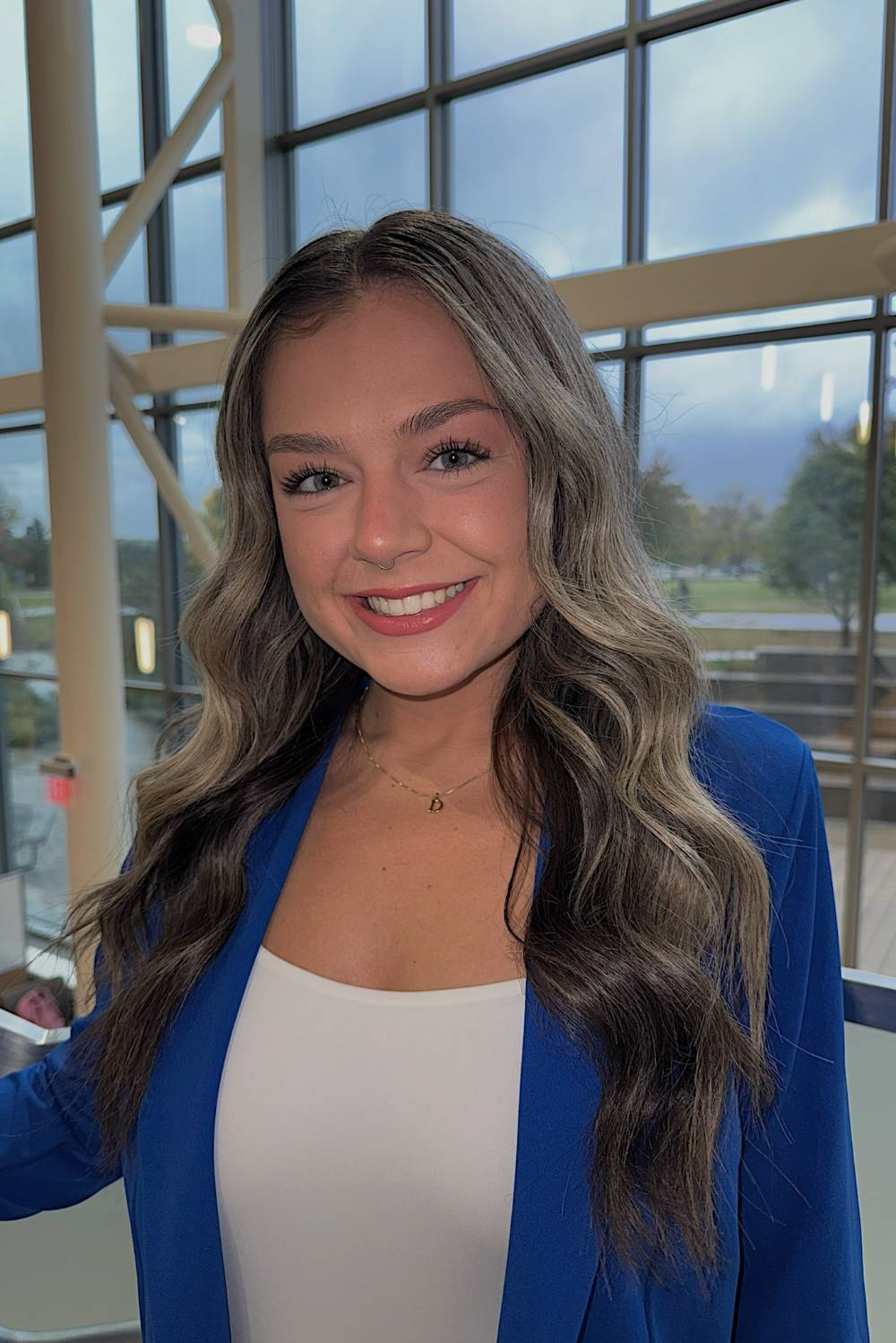 Image 1 of 2 Female student professional headshot in front of windows